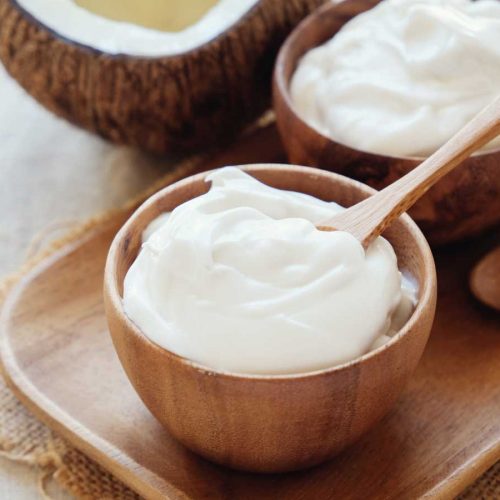Coconut yoghurt and a coconut shell